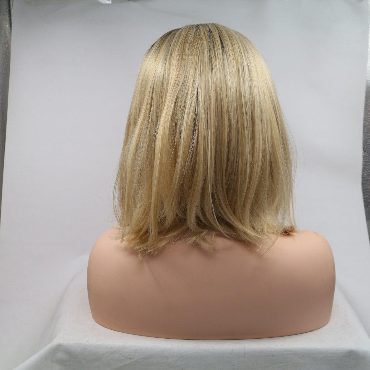 a blonde wig sitting on top of a white table