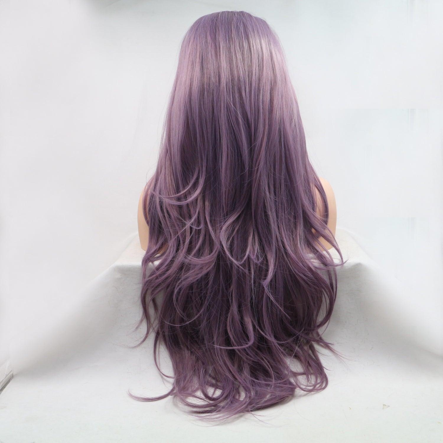 a woman with long purple hair sitting down