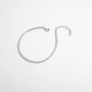 a bracelet with a chain and a clasp on a white background