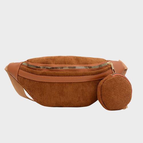 a brown belt bag with a small round purse on top of it