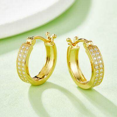 a pair of yellow gold hoop earrings with diamonds