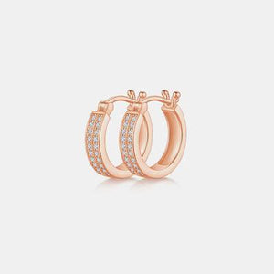 a pair of rose gold hoop earrings with diamonds