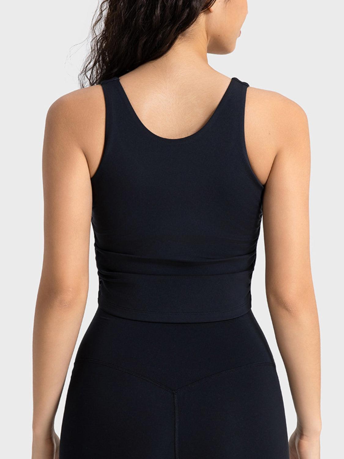 the back of a woman wearing a black bodysuit