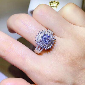 a close up of a person's hand with a ring on it