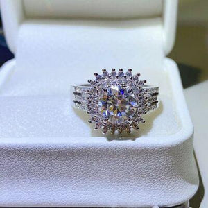 a diamond ring sitting on top of a white box