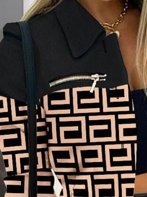 a woman holding a black and white purse