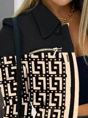 a woman holding a black and white purse