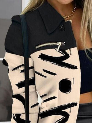 a woman wearing a black and white jacket with a zipper