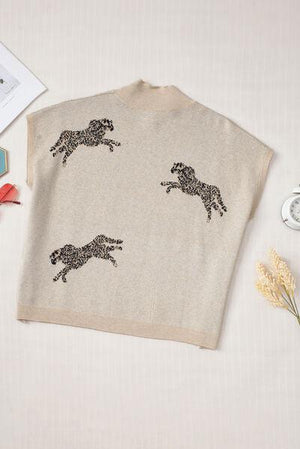 a sweater with a picture of a running horse on it