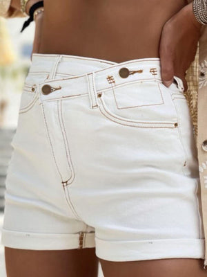 a close up of a person wearing white shorts