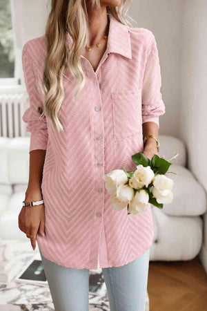 a woman wearing a pink shirt and jeans