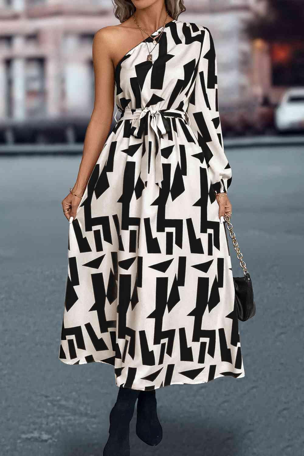 a woman in a black and white dress