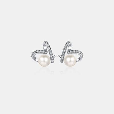 a pair of pearl and diamond earrings