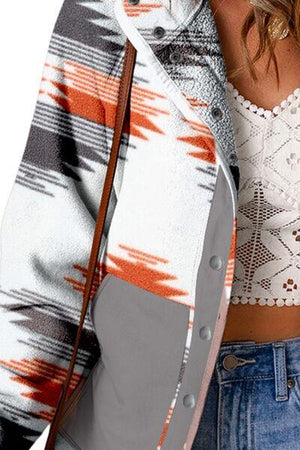 a woman wearing a white top and blue jeans