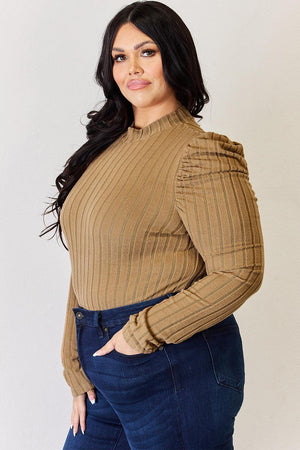 a woman posing for a picture with her hands on her hips