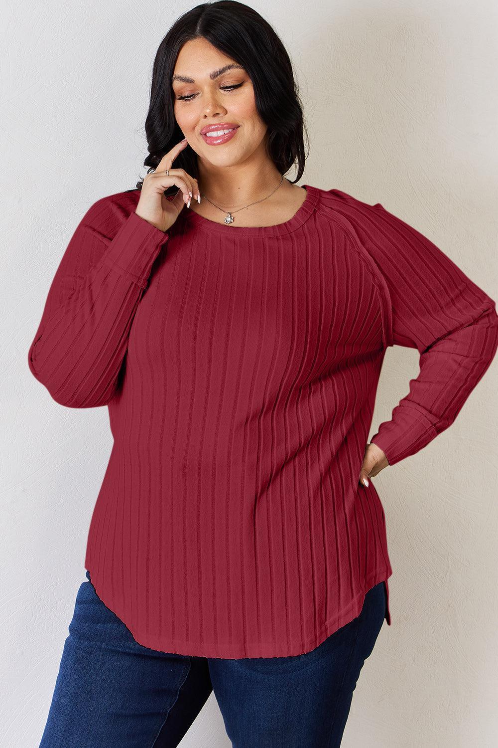 a woman in a red sweater is talking on a cell phone