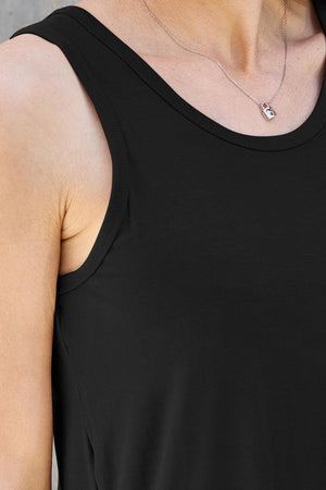 a woman wearing a black shirt and a necklace