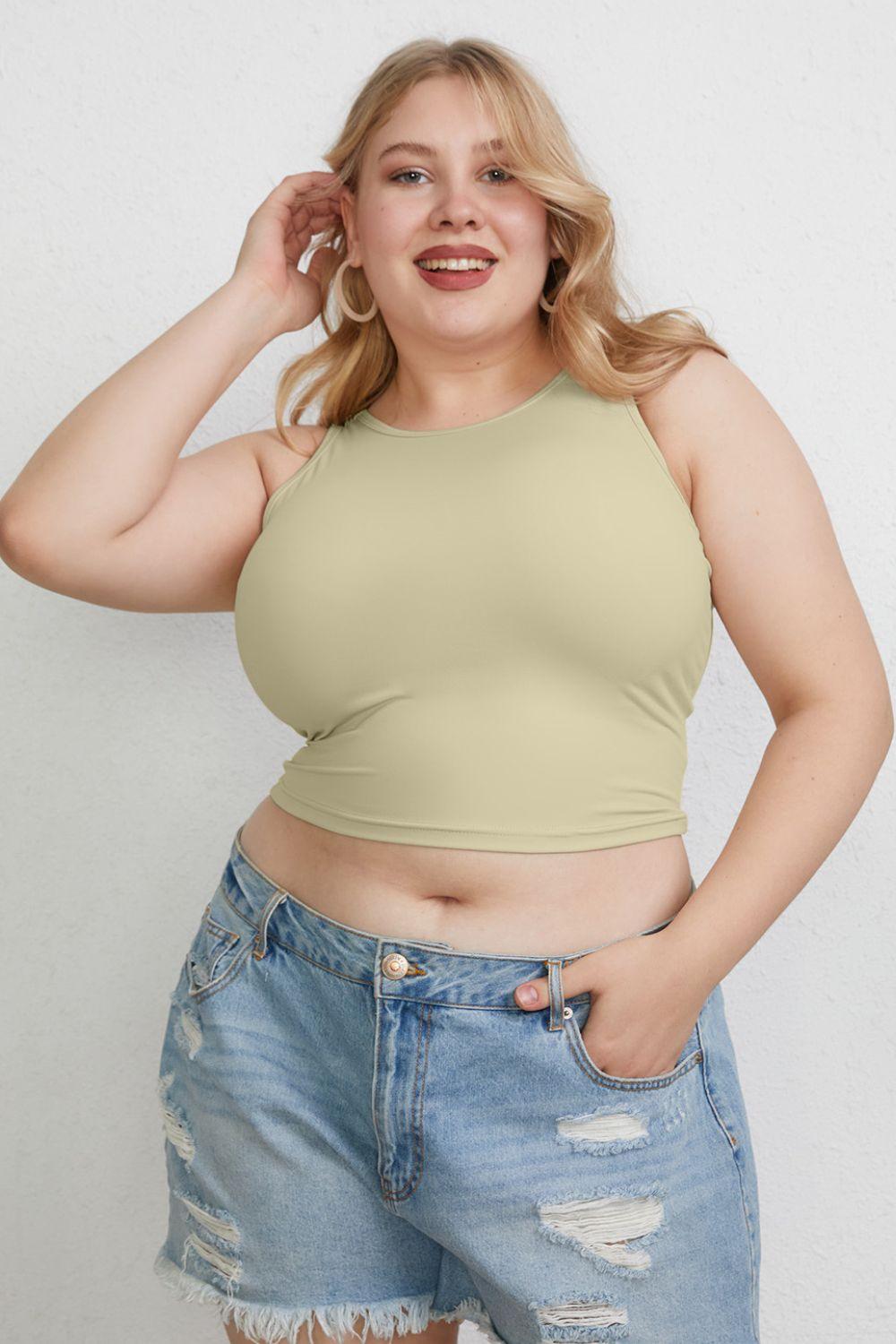 a woman in a short jean shorts and a tank top