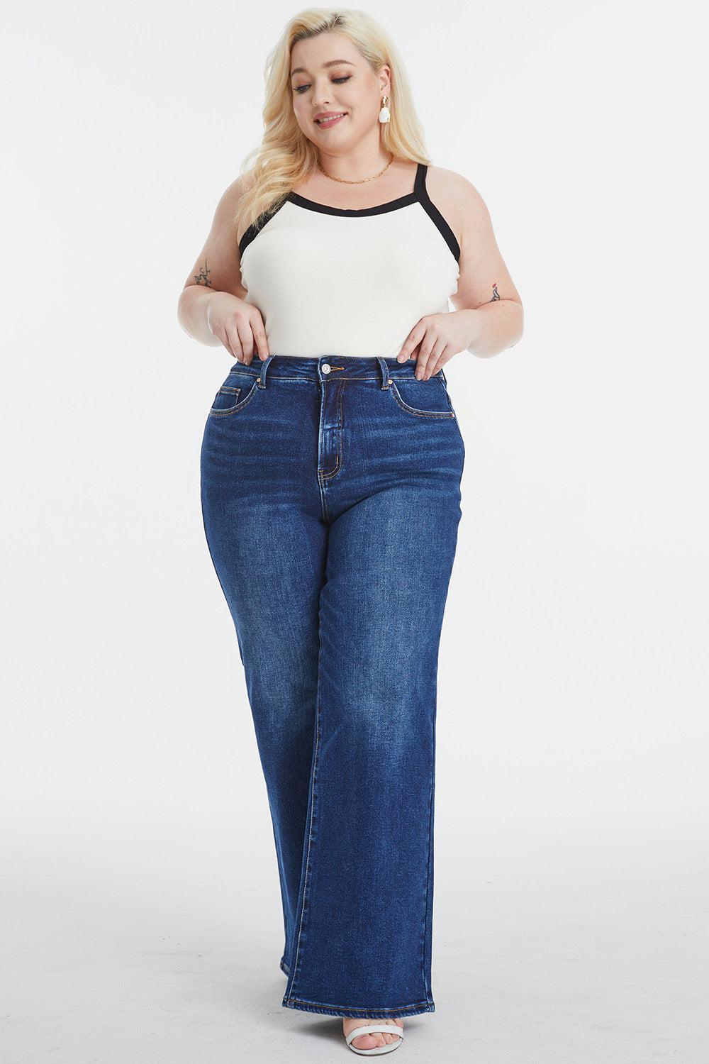 a woman in a white top and blue jeans