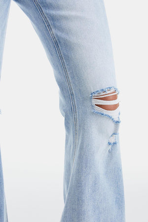a pair of ripped jeans with a hole in the side