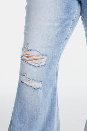 a pair of ripped jeans with a hole in the side