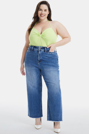 a woman in a yellow top and blue jeans