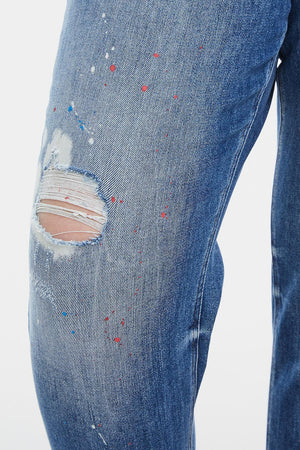 a close up of a person wearing ripped jeans