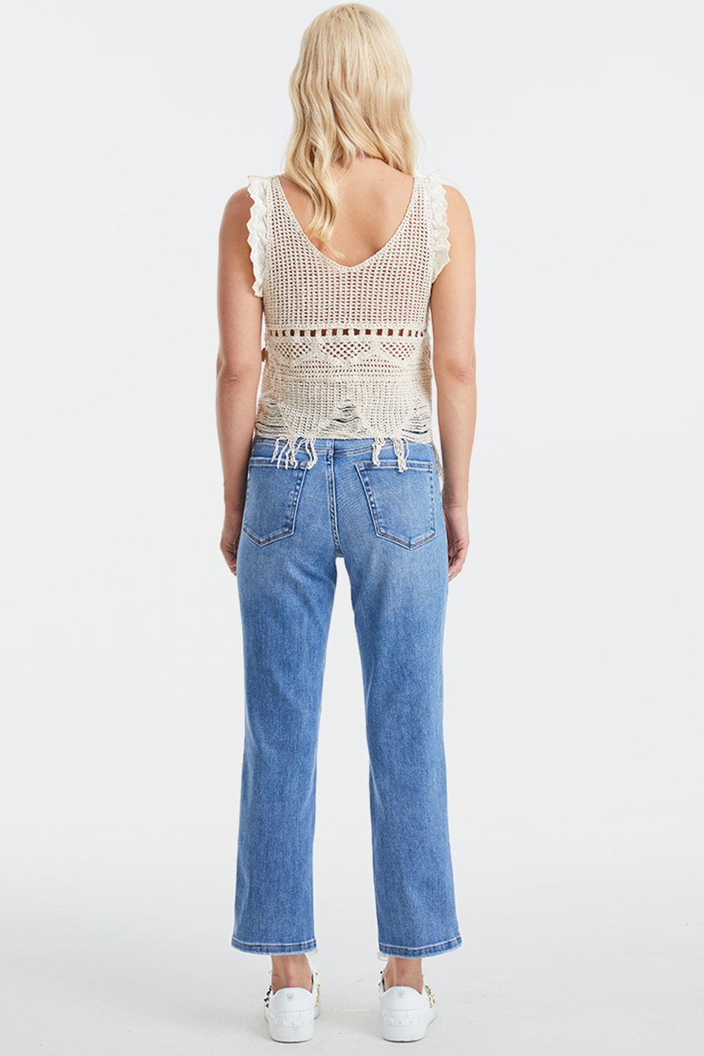 a woman in a tank top and jeans back view