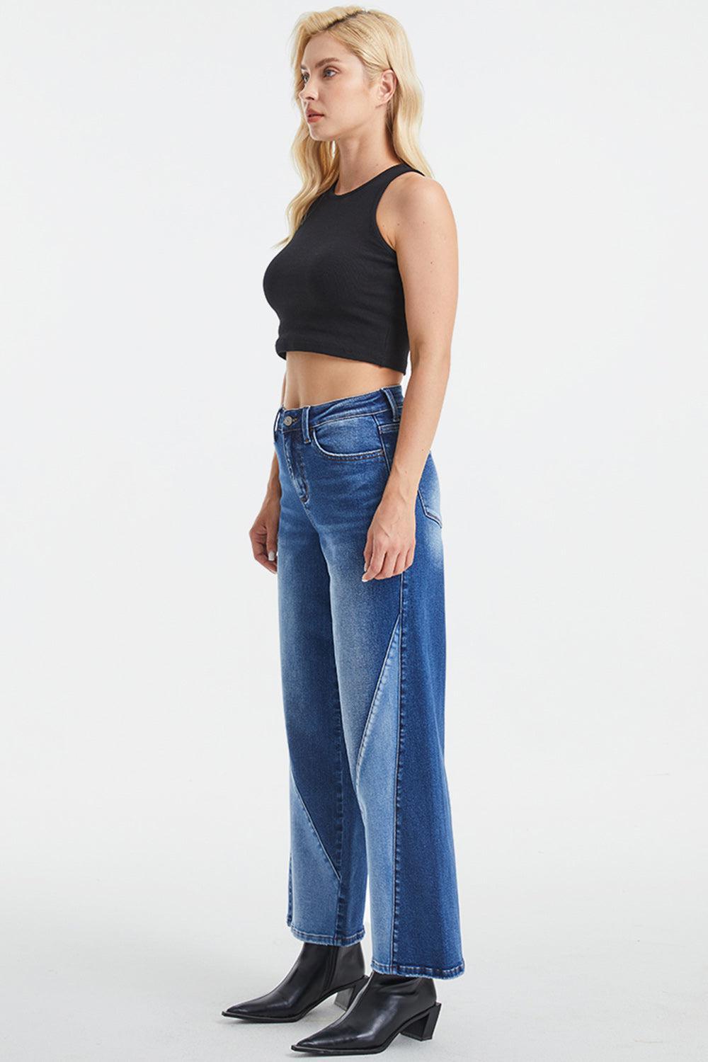 a woman in a black crop top and jeans