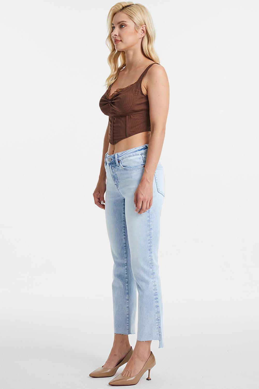 a woman in a brown top and jeans