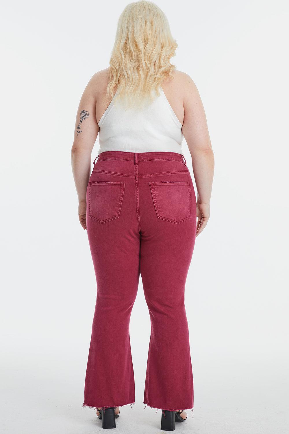a woman in a white top and red pants
