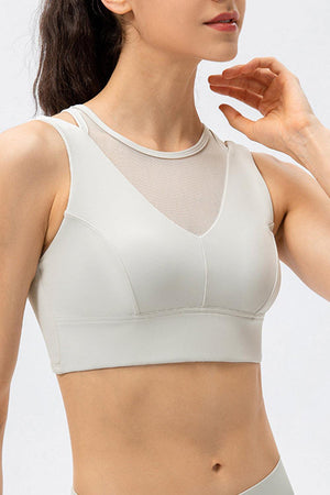 a woman wearing a white sports bra top