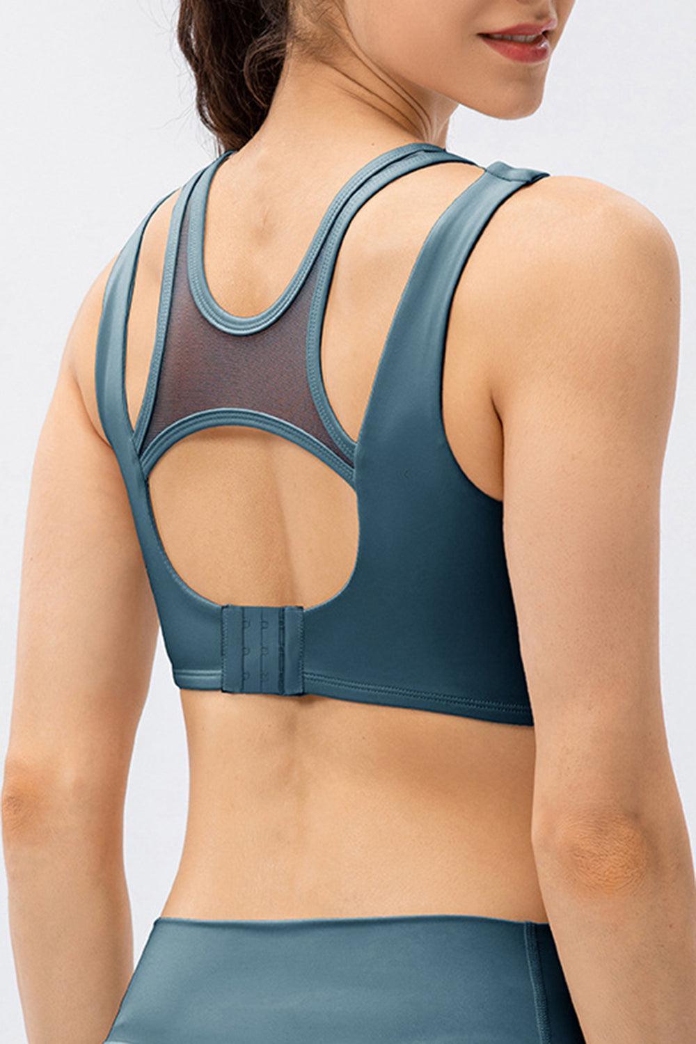 a woman wearing a sports bra with a mesh back