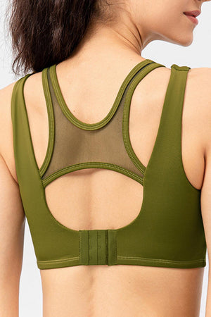 a woman wearing a green sports bra top