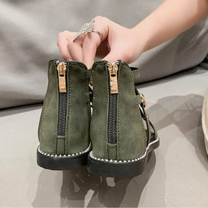 a woman is putting on a pair of green shoes