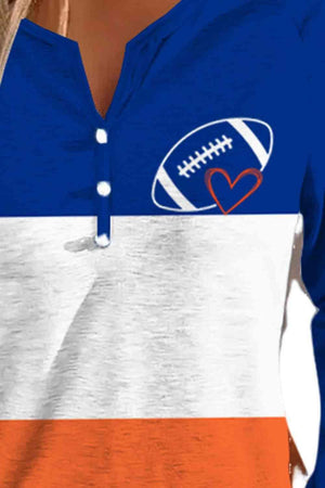 a woman wearing an orange, white, and blue shirt with a football on it