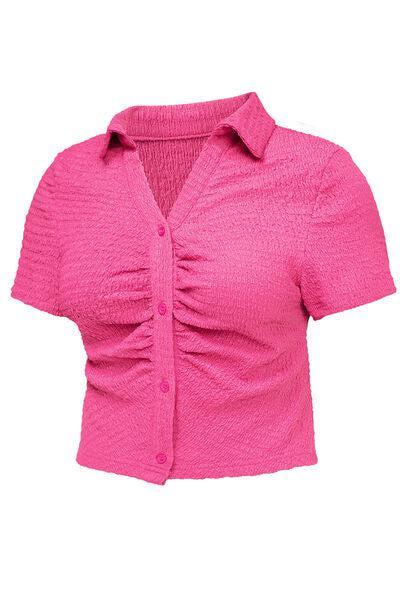 a women's pink shirt with a short sleeve