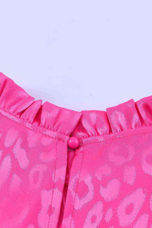 a close up of a pink leopard print skirt