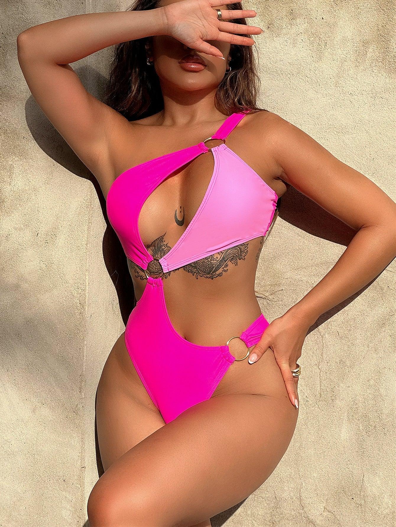 a woman in a pink swimsuit posing for a picture