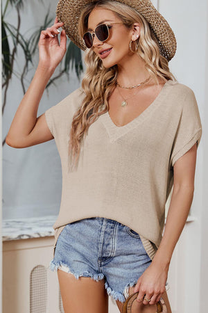 a woman wearing a straw hat and sunglasses