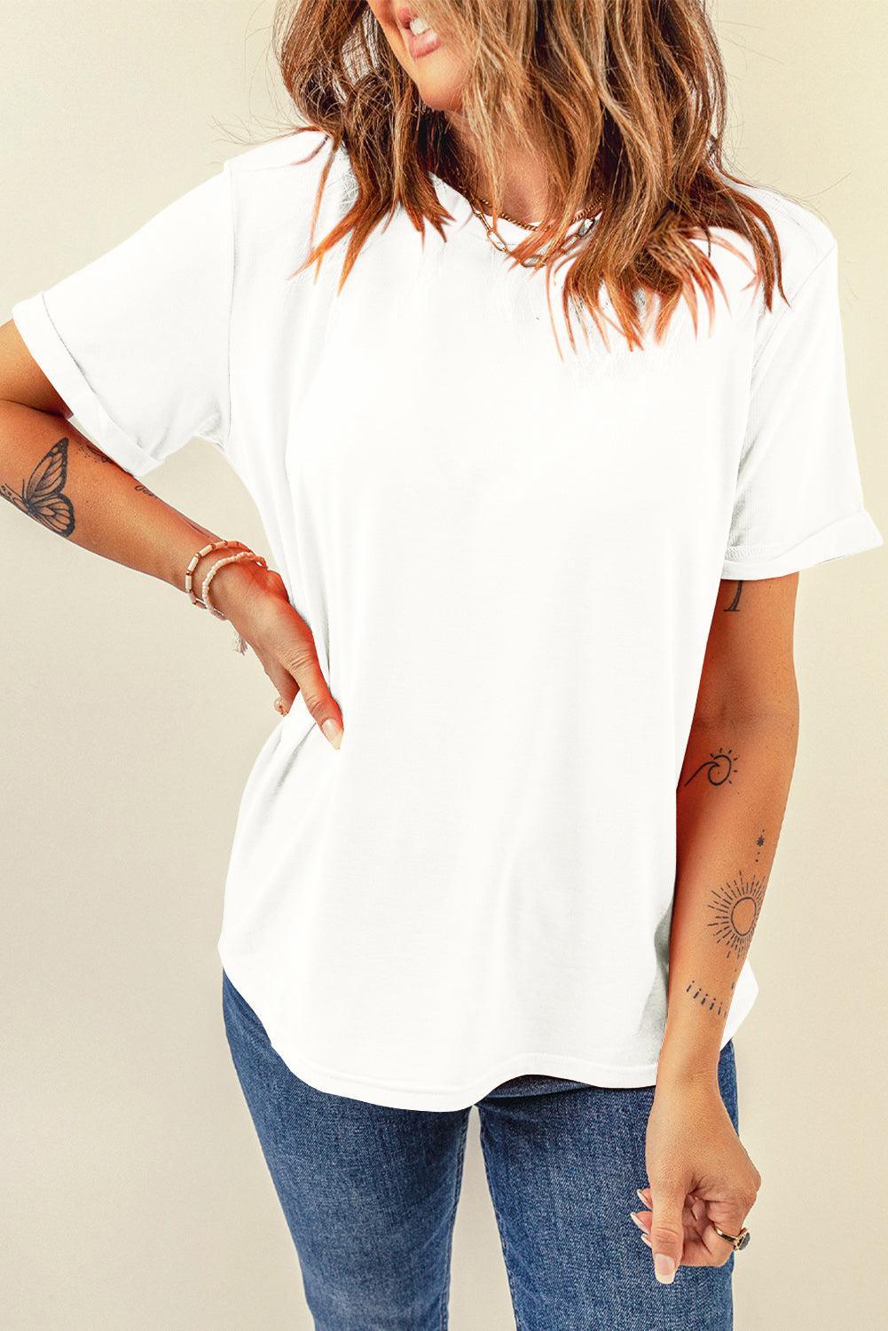 a woman wearing a white shirt and jeans