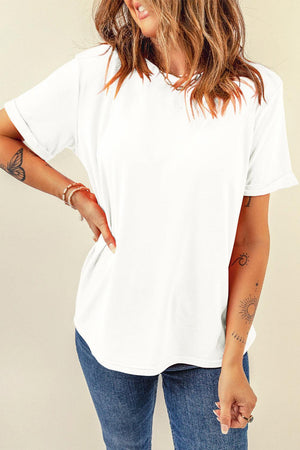 a woman wearing a white shirt and jeans