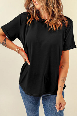 a woman wearing a black shirt and jeans