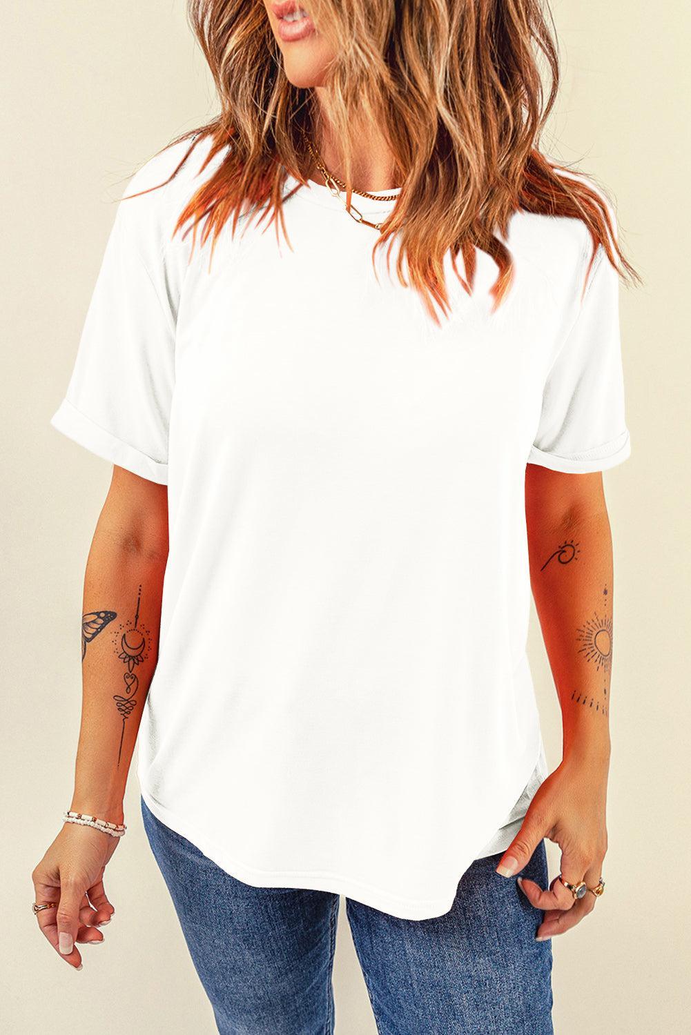 a woman wearing a white shirt and jeans