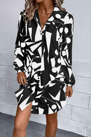 a woman wearing a black and white shirt dress