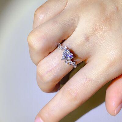 a close up of a person's hand with a ring on it