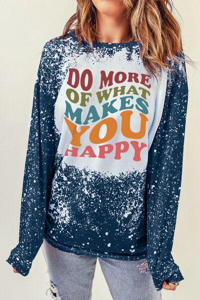 a woman wearing a do more of what makes you happy shirt