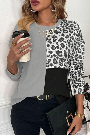 a woman holding a cup of coffee and a purse