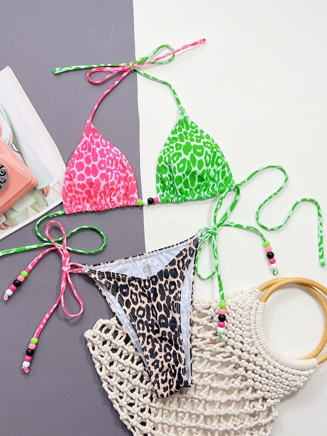 a group of bikinis and accessories laid out on a table