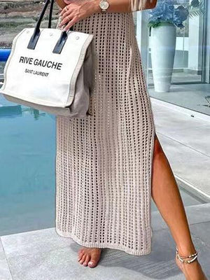 a woman in a white dress holding a white bag